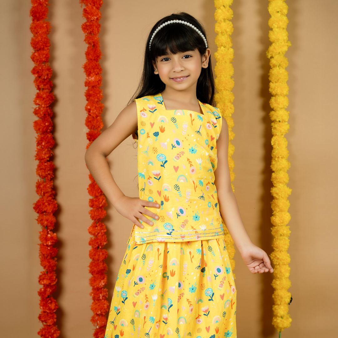 Yellow Floral Lehenga Set: A woman wears a vibrant yellow lehenga with intricate floral embroidery and a matching dupatta.