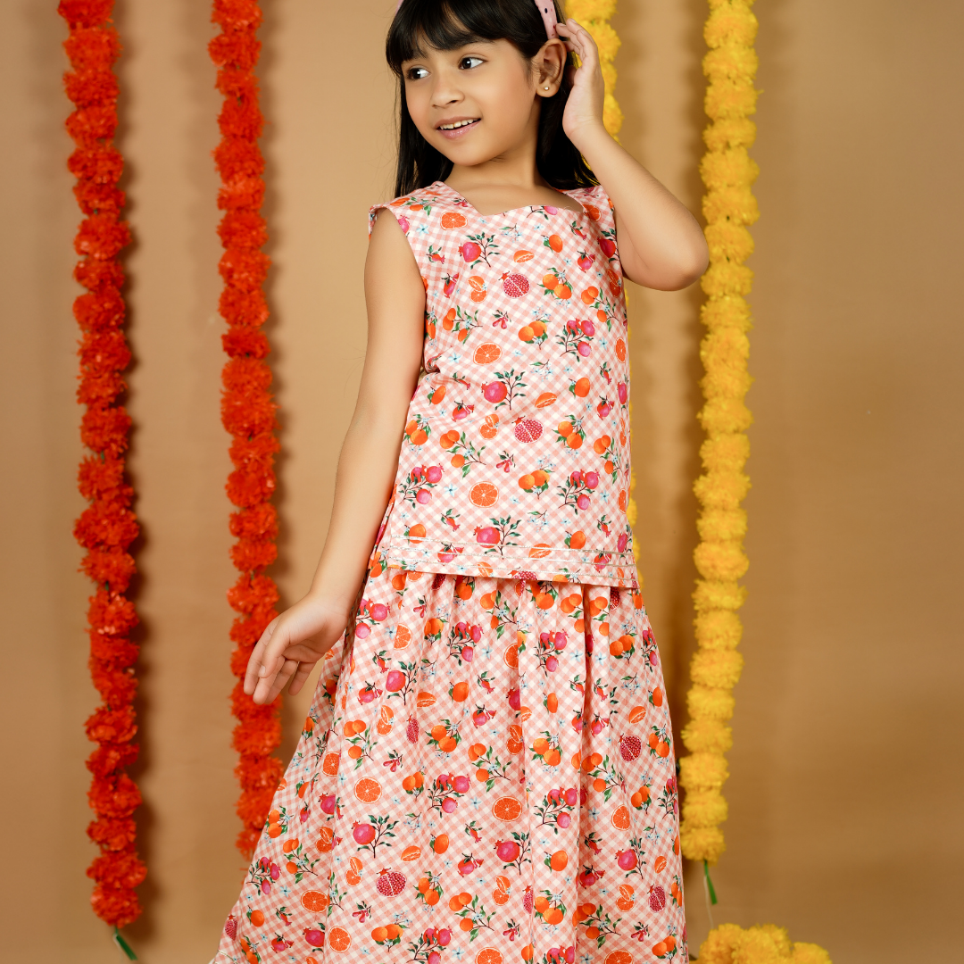 Fruity Gingham Lehenga Set: A vibrant pink and white gingham lehenga with embroidered fruit motifs.