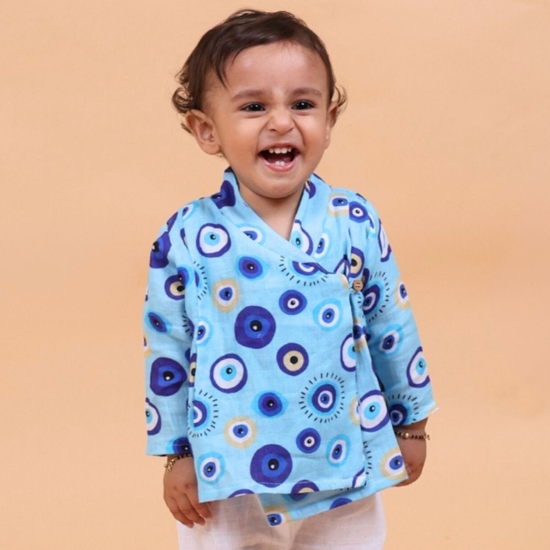 Evil Eye Blue Muslin Angrakha Set featuring intricate embroidery and flowing sleeves on a model.