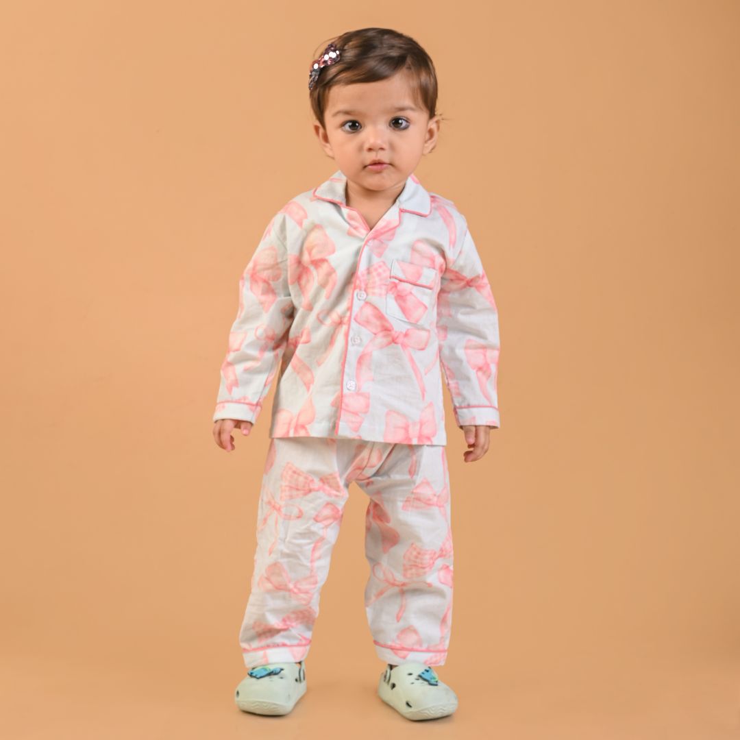 Pretty Bows Full Sleeves Night Suit featuring a soft pink fabric with delicate white bow accents and matching drawstring