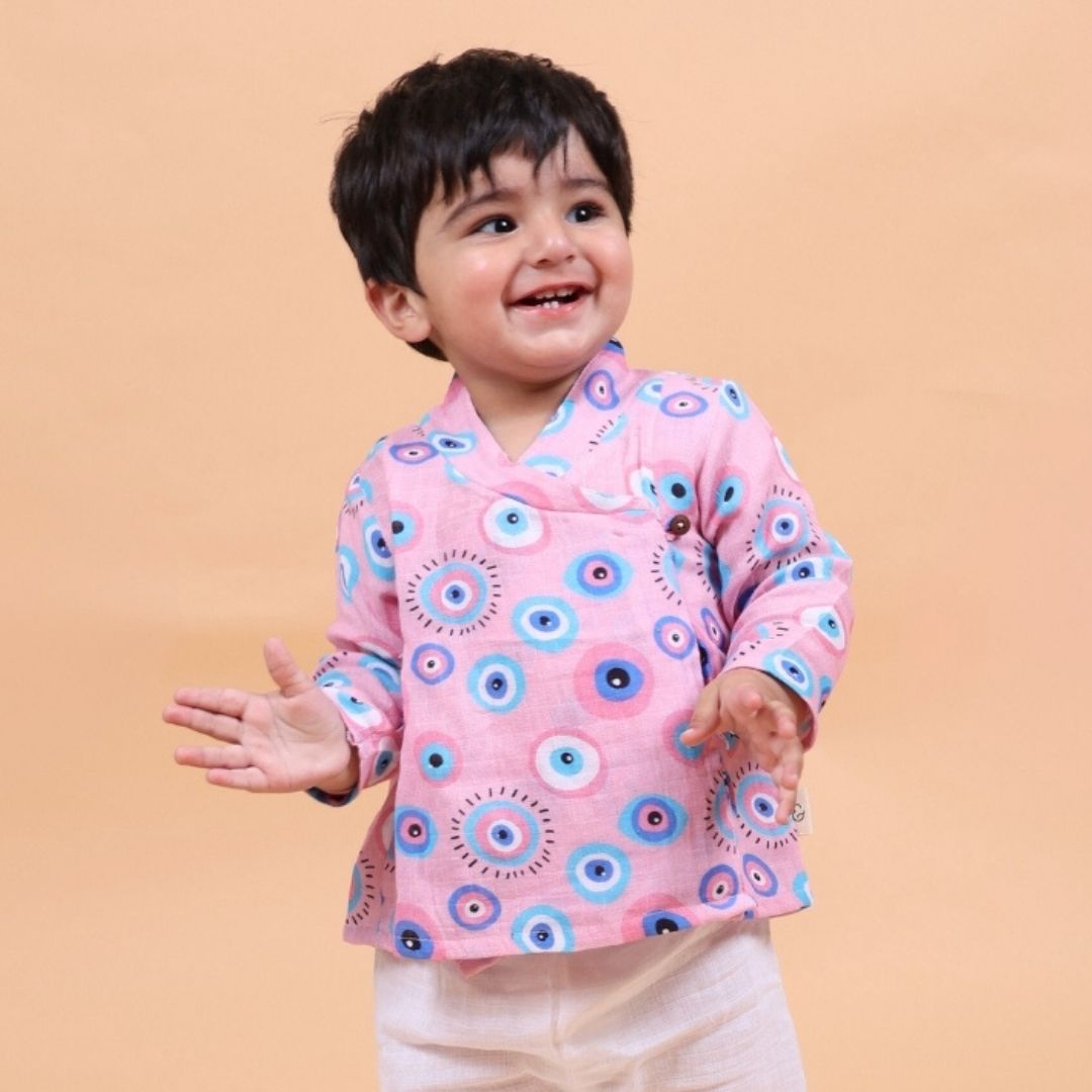 Pink Evil Eye Muslin Angrakha Set: A beautifully embroidered angrakha dress with matching pants, featuring intricate evil