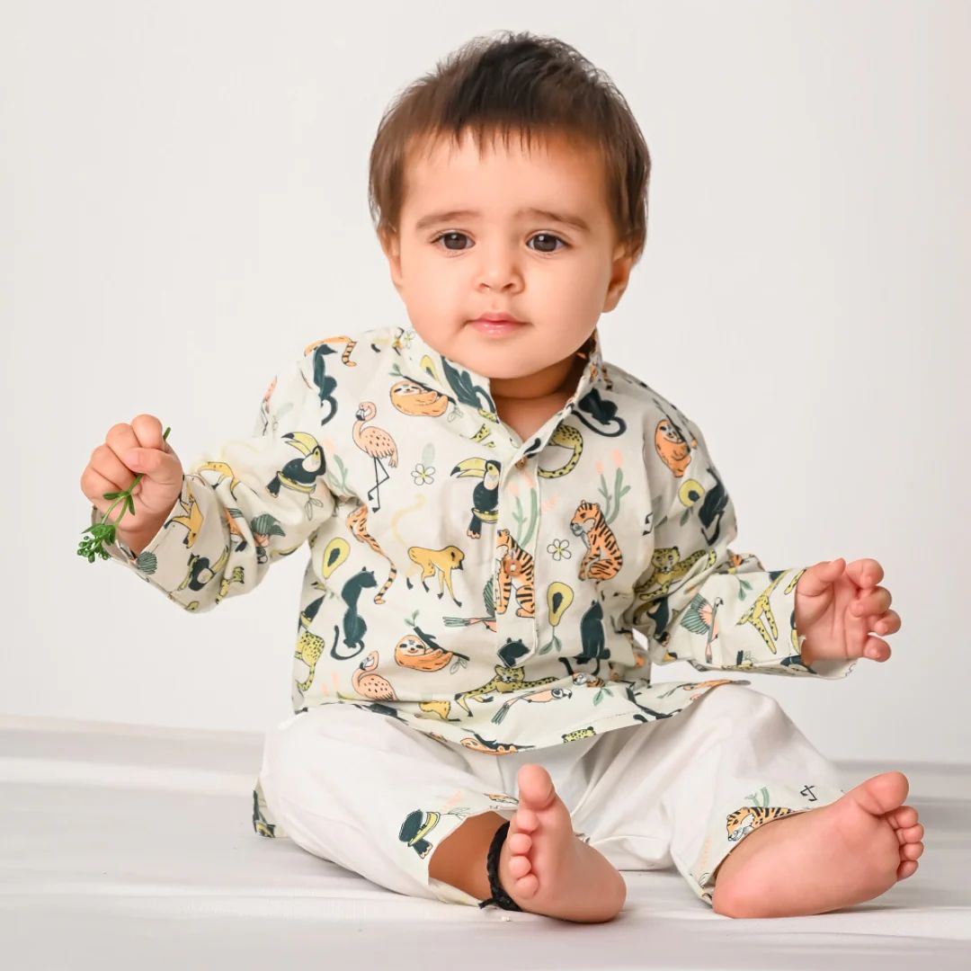 Rainforest Animals Cotton Kurta Set for kids, featuring a vibrant print of monkeys, toucans, and jaguars on a green kurta.