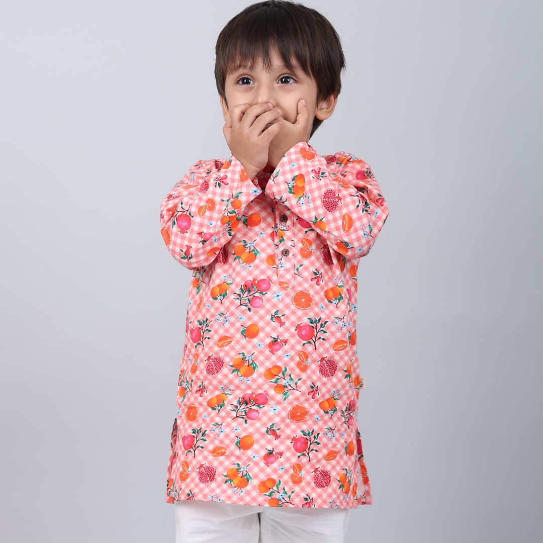 Fruity Gingham Kurta Set: A woman models a comfortable, pink and white gingham kurta with matching pants and a delicate