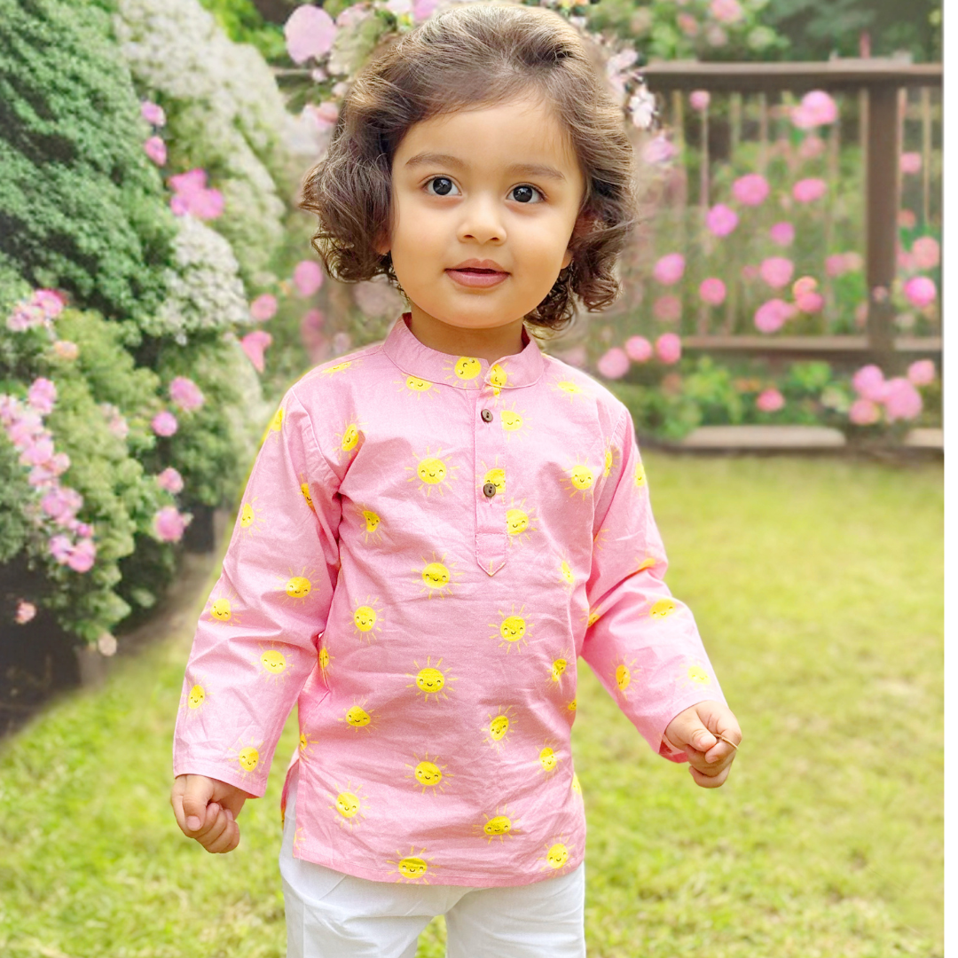 A Pink Sun Cotton Kurta Set with intricate embroidery on the neckline and sleeves.