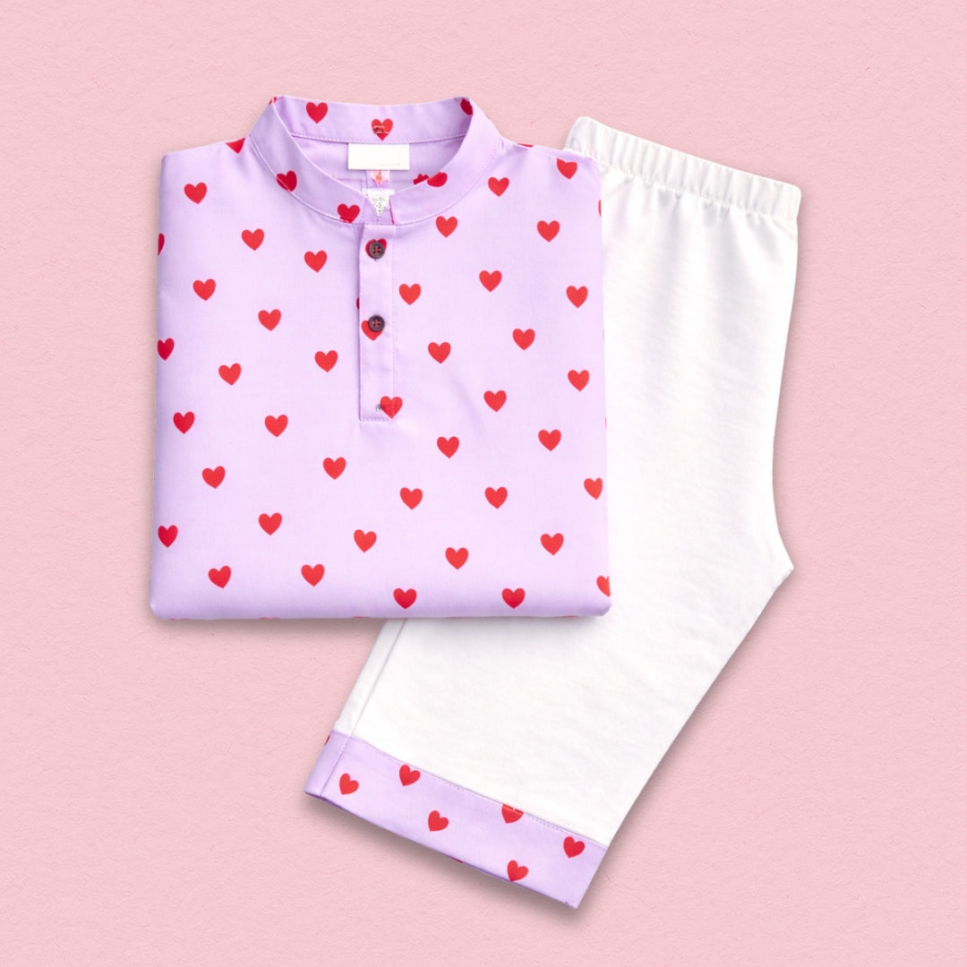 A woman wears a Love Cotton Kurta Set with intricate embroidery on the neckline.