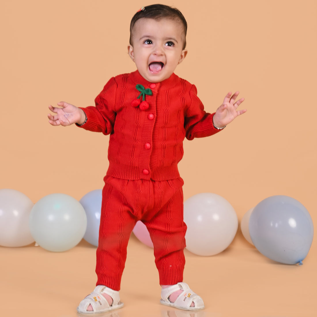 Red Cherry Applique Knitted Winter Co-Ord Set: Cozy sweater and matching trousers with cherry details.