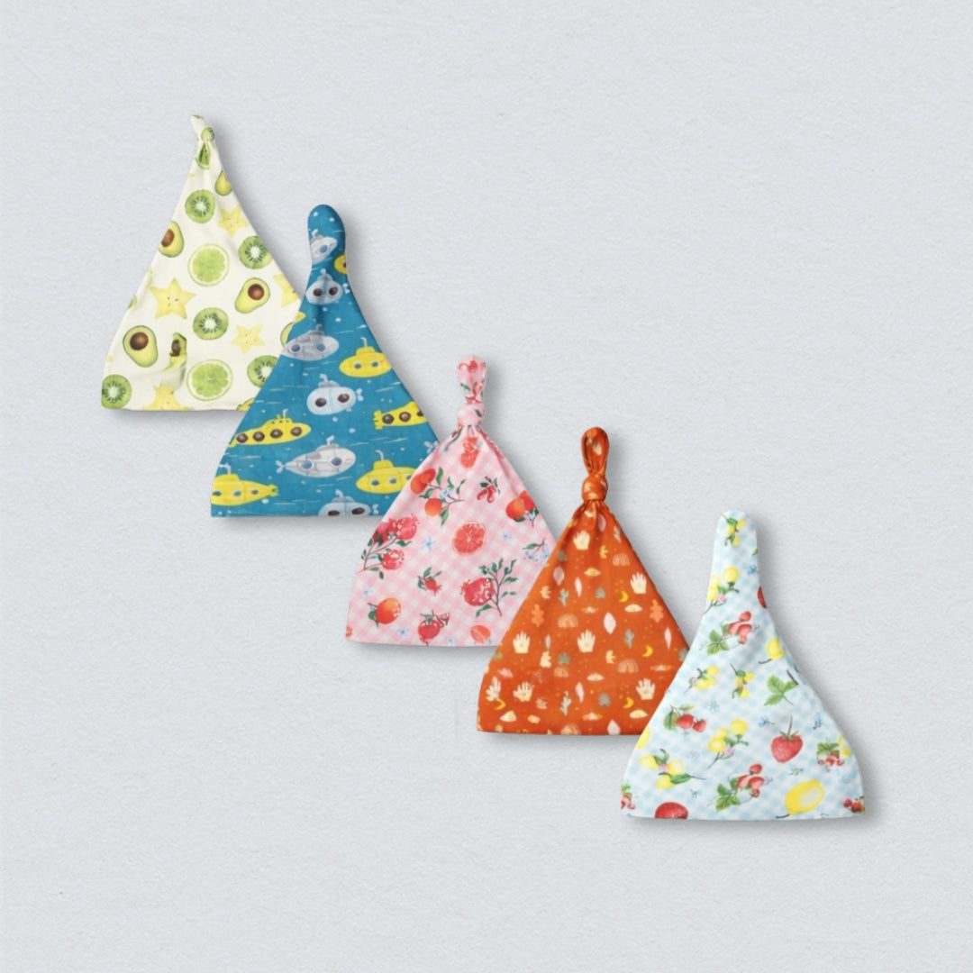 Cotton Knot Hats Bundle: A set of three soft, white cotton baby hats with adjustable knot ties.